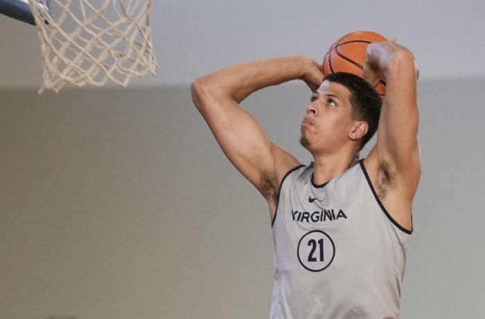 Kadin Shedrick dunks the ball during the Virginia men's basketball game against KK Mega Basket in Rapallo, Italy.